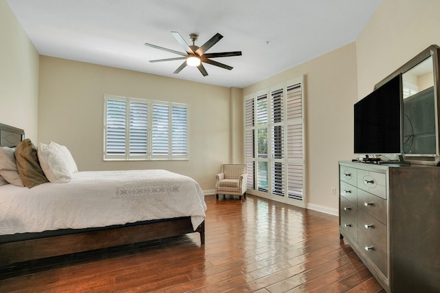 bedroom featuring dark hardwood / wood-style floors and ceiling fan