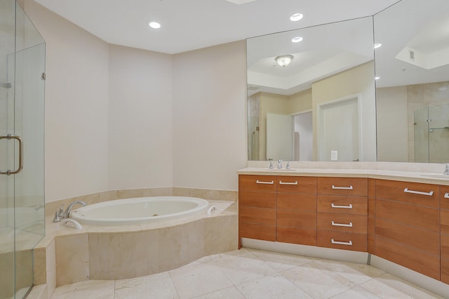 bathroom with plus walk in shower, vanity, and tile patterned flooring