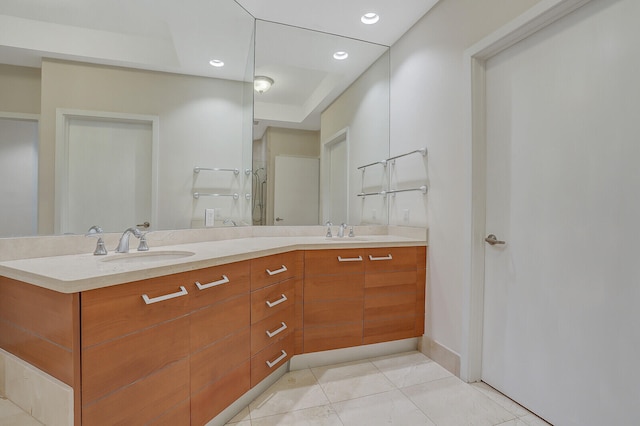 bathroom featuring tile patterned flooring and vanity