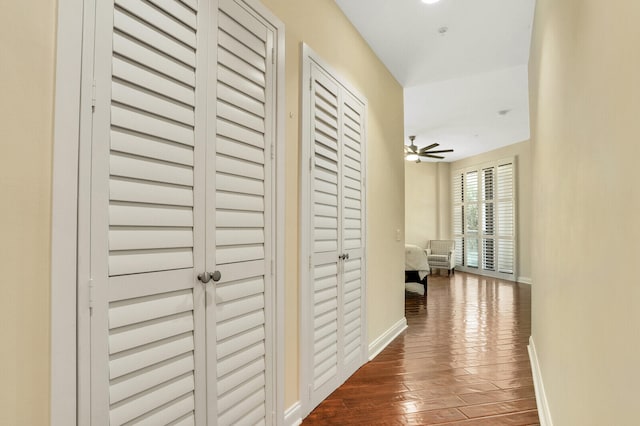 corridor with dark wood-type flooring