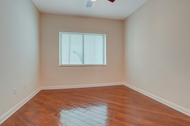 unfurnished room with hardwood / wood-style floors and ceiling fan