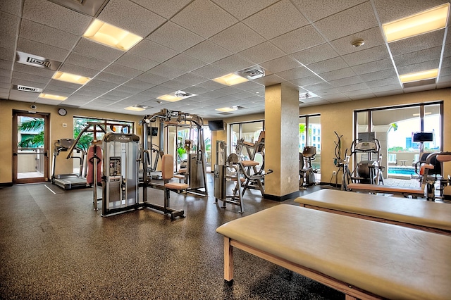 gym featuring a drop ceiling