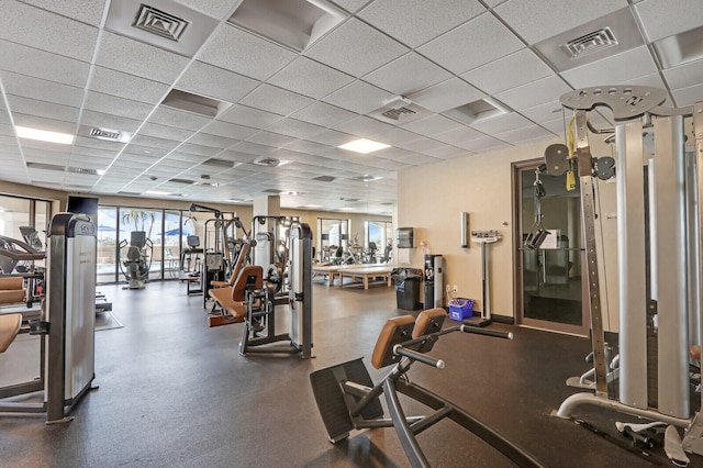 gym featuring a drop ceiling