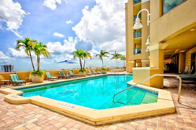 view of swimming pool featuring a patio area