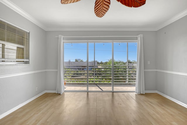 unfurnished room with crown molding and light hardwood / wood-style flooring