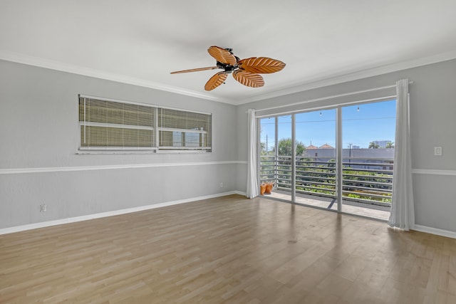 unfurnished room with light hardwood / wood-style floors, crown molding, and ceiling fan