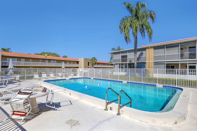 view of pool featuring a patio