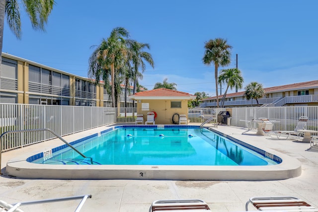 view of swimming pool with a patio