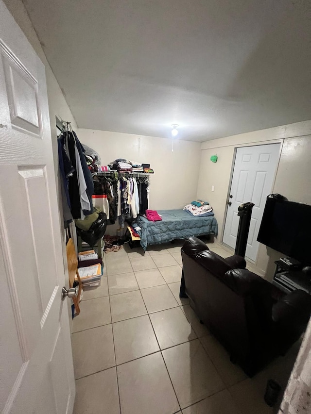 bedroom featuring light tile patterned floors