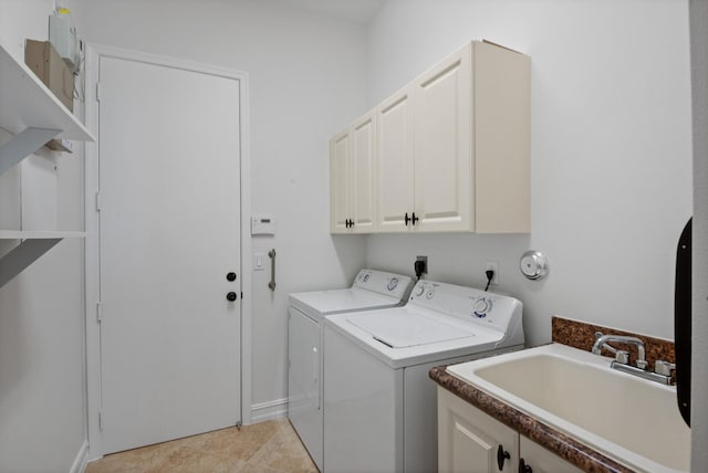 clothes washing area featuring cabinets, separate washer and dryer, light tile patterned floors, and sink