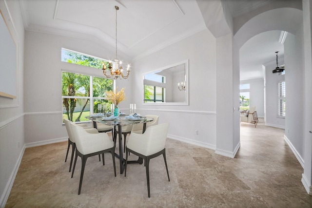 dining area featuring a notable chandelier, ornamental molding, and a healthy amount of sunlight