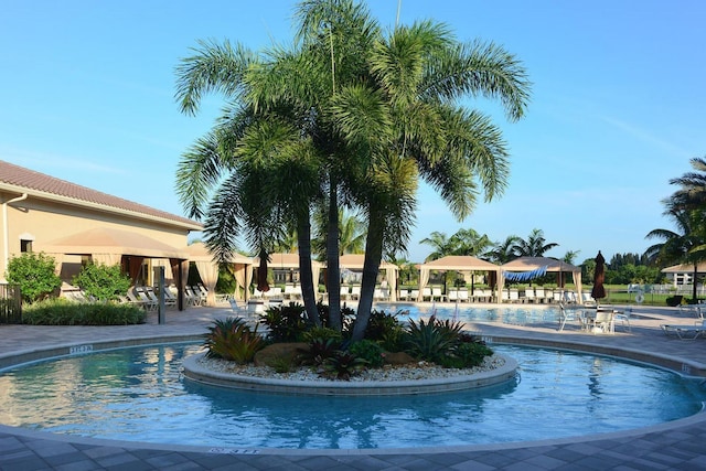 view of swimming pool featuring a gazebo and a patio