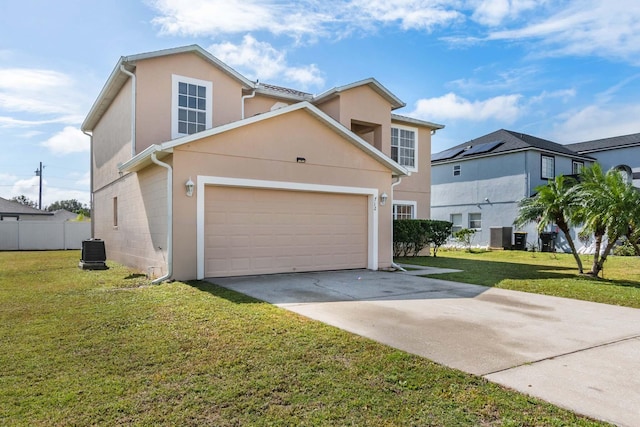 front of property featuring a front yard, central AC unit, and a garage