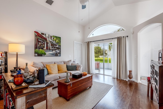 living room featuring hardwood / wood-style flooring and high vaulted ceiling