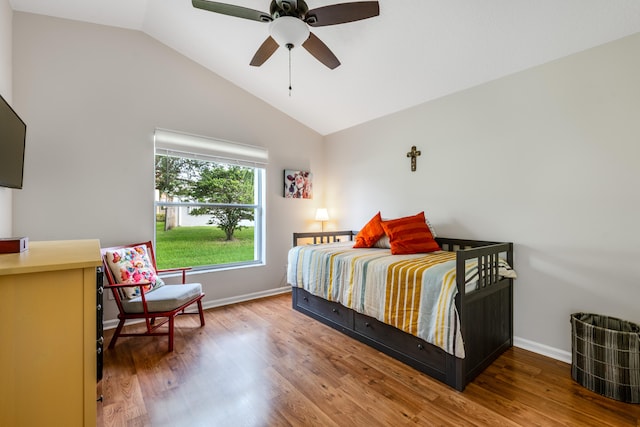 bedroom featuring lofted ceiling, hardwood / wood-style flooring, and ceiling fan