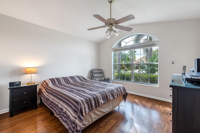 bedroom with vaulted ceiling, dark hardwood / wood-style floors, and ceiling fan