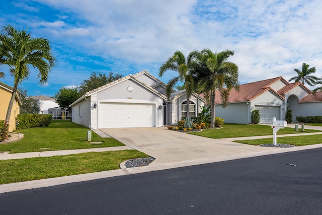 view of front facade with a garage and a front lawn