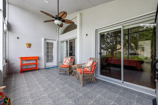 sunroom / solarium featuring vaulted ceiling and ceiling fan