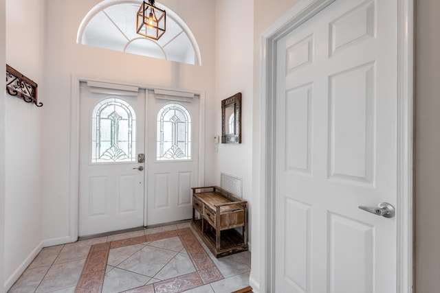 entrance foyer with light tile patterned flooring