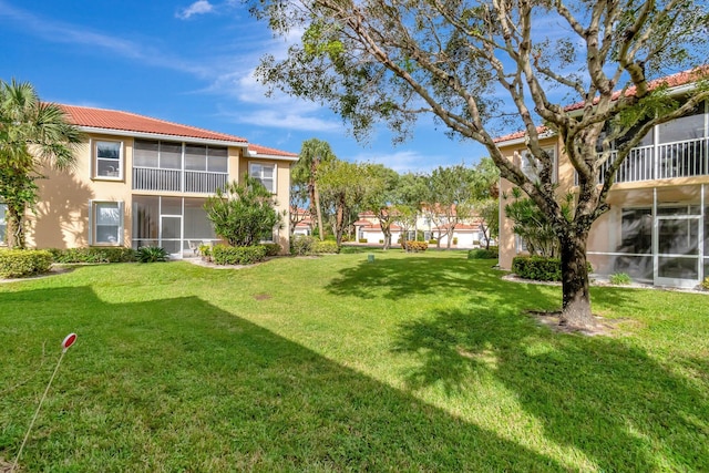 view of yard featuring a sunroom