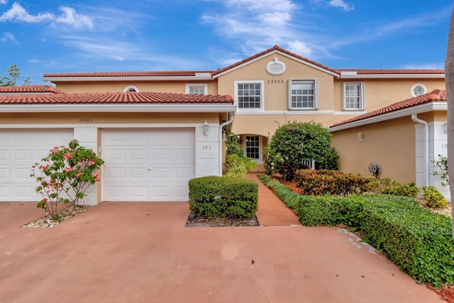 mediterranean / spanish-style house featuring a garage