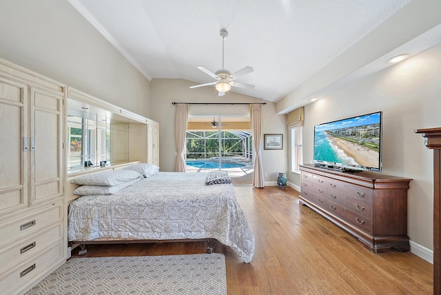 bedroom featuring access to outside, light hardwood / wood-style flooring, ceiling fan, and lofted ceiling