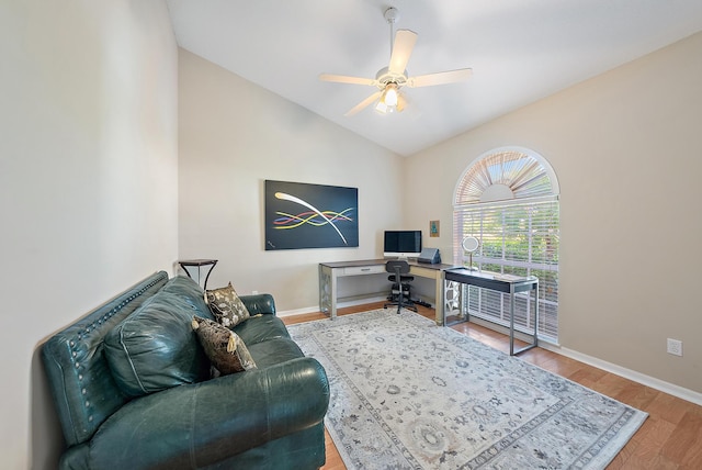 office featuring ceiling fan, wood-type flooring, and vaulted ceiling