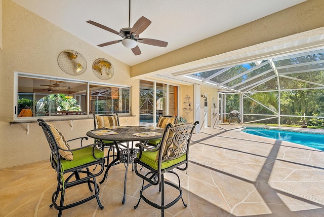 exterior space with glass enclosure and ceiling fan