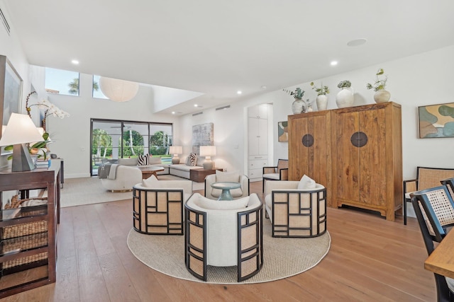 living room with light hardwood / wood-style flooring