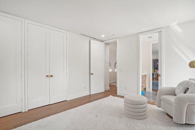 sitting room with hardwood / wood-style floors