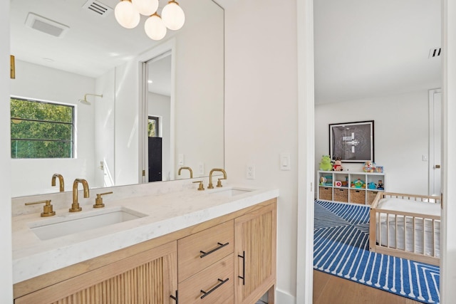 bathroom with vanity and wood-type flooring