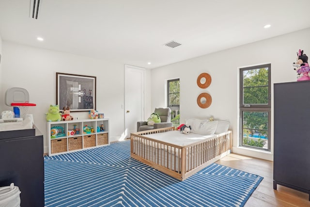 bedroom featuring hardwood / wood-style flooring