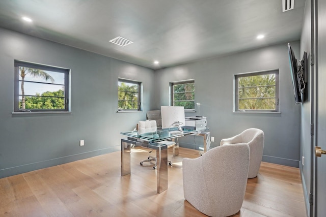 office with light hardwood / wood-style flooring