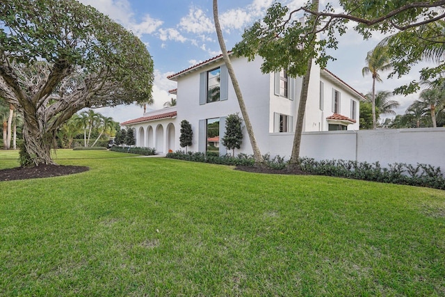 rear view of house with a lawn