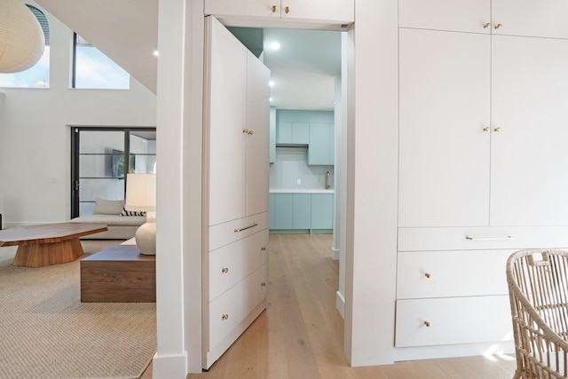 bedroom with lofted ceiling and light hardwood / wood-style flooring