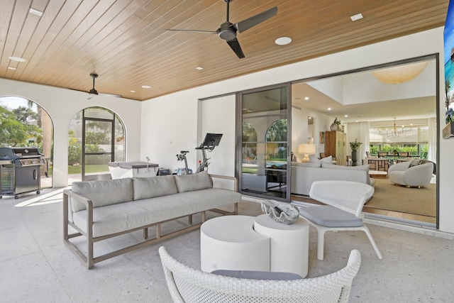 view of patio featuring outdoor lounge area, area for grilling, and ceiling fan