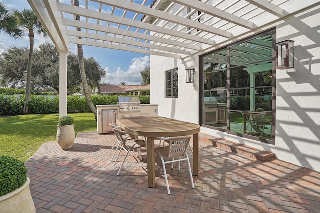 view of patio with an outdoor kitchen, grilling area, and a pergola