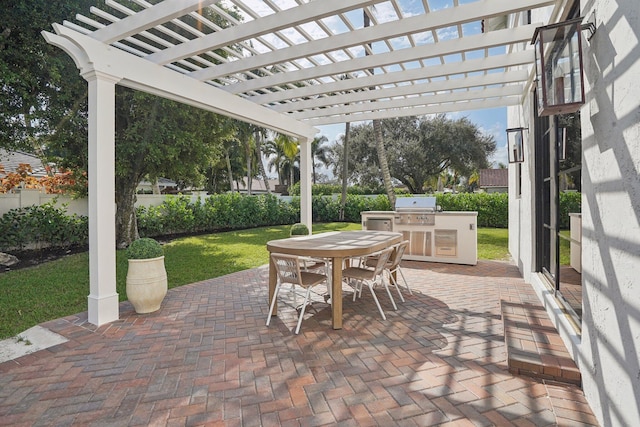 view of patio with area for grilling, a grill, and a pergola