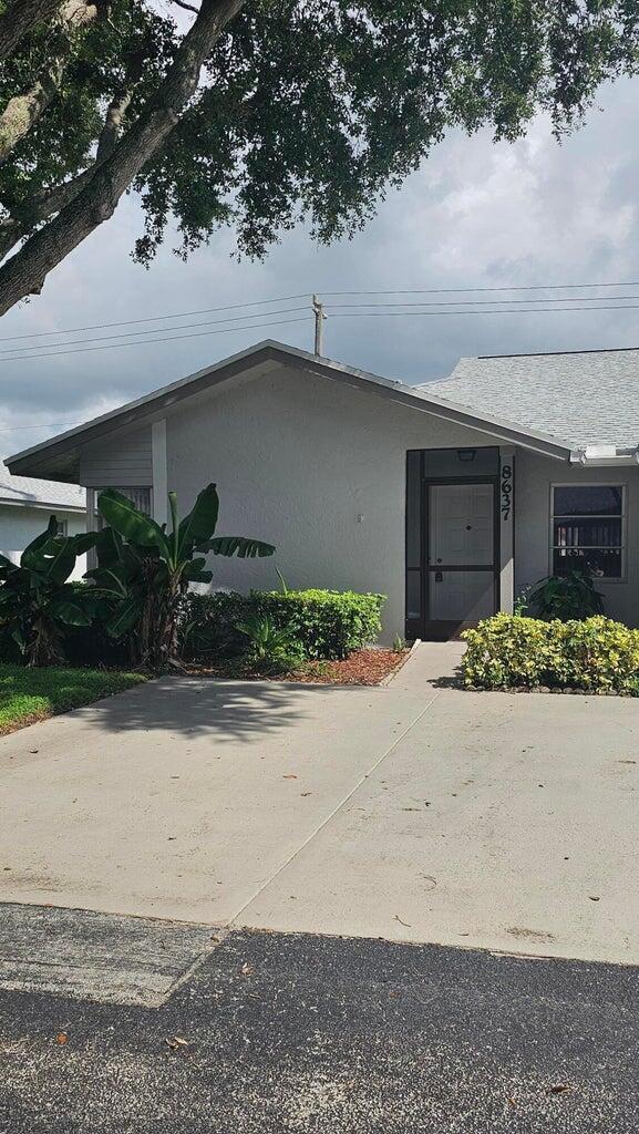8637 Sunbird Pl, Boca Raton, FL 33496 - view of home's exterior with stucco siding