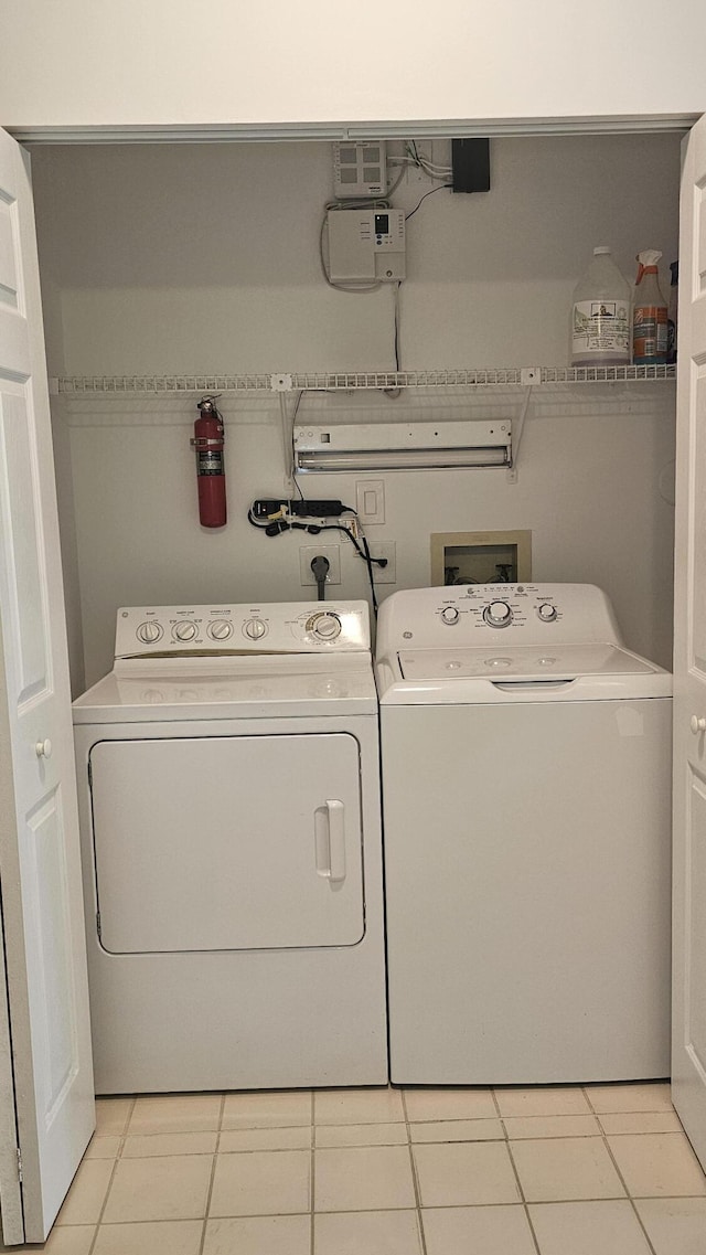 8637 Sunbird Pl, Boca Raton, FL 33496 - clothes washing area featuring laundry area, separate washer and dryer, and light tile patterned floors