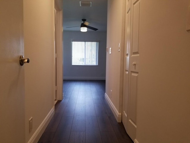 hallway featuring dark wood-type flooring