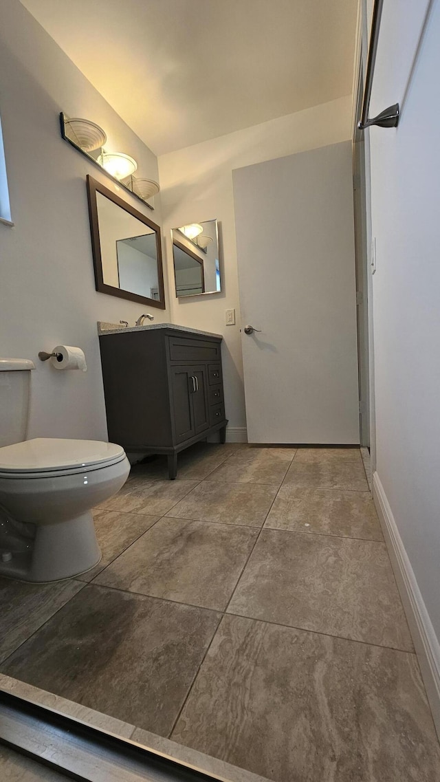8637 Sunbird Pl, Boca Raton, FL 33496 - bathroom featuring toilet, baseboards, and vanity