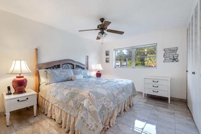 bedroom featuring a closet and ceiling fan