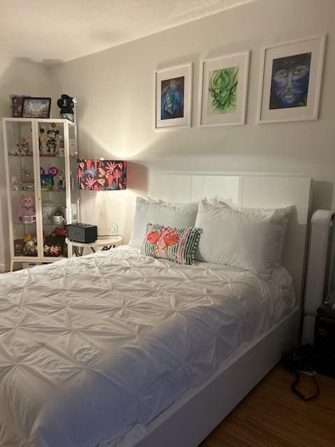 bedroom featuring wood-type flooring