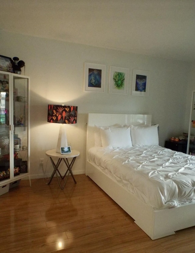 bedroom featuring hardwood / wood-style floors