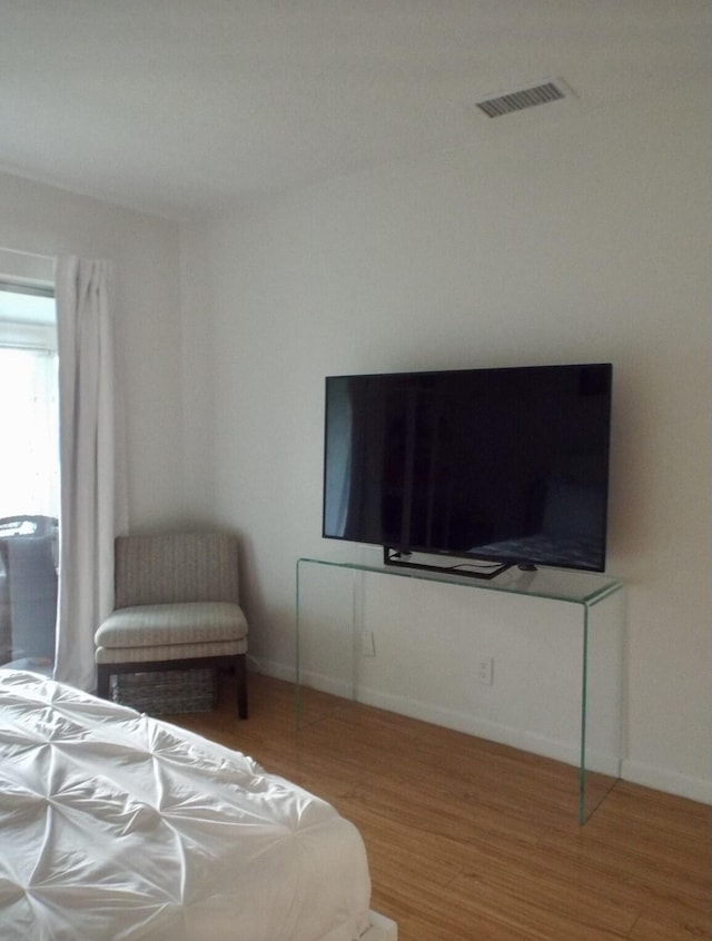 bedroom featuring hardwood / wood-style floors