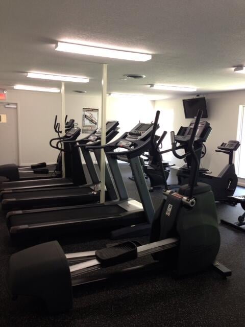 workout area featuring a textured ceiling