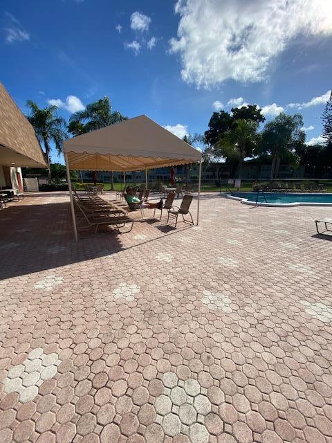 exterior space with a gazebo, a patio, and a swimming pool