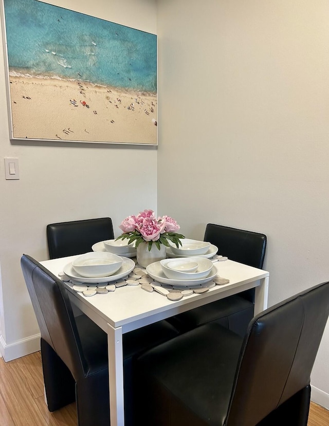 dining space with light hardwood / wood-style floors