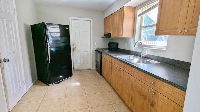 kitchen with black appliances, sink, and light tile patterned floors